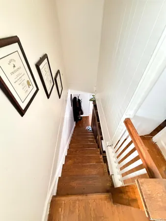 a bathroom with a toilet sink and shower curtain