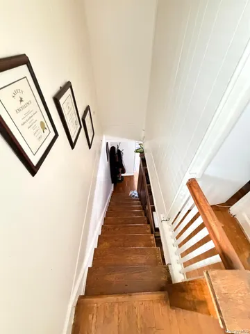 a bathroom with a toilet sink and shower curtain