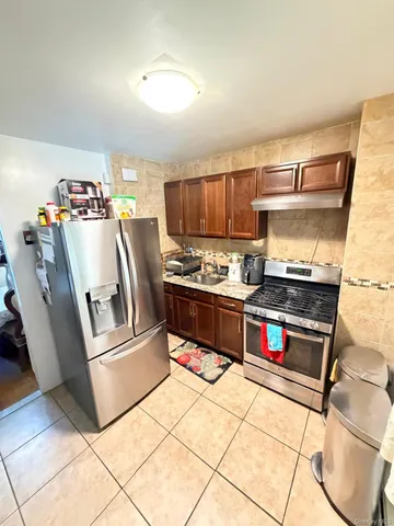 a bedroom with a bed and a night stand