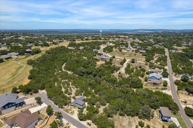 an aerial view of residential building and green space