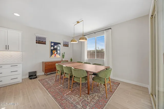 a living room with furniture and flowers