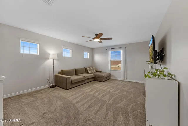 a spacious bathroom with a double vanity sink a large mirror a shower and vanity