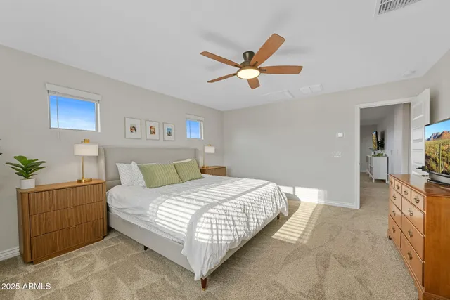 a bathroom with a granite countertop tub shower and mirror