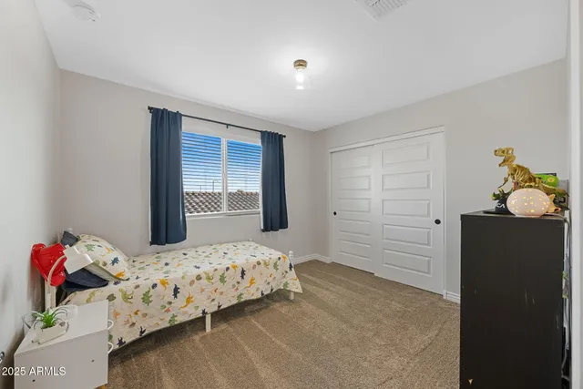 a room with a mirror a sink and a mirror