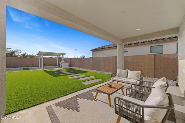 a front view of a house with a yard table and chairs