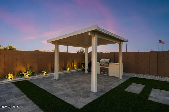 a view of a big house with a big yard
