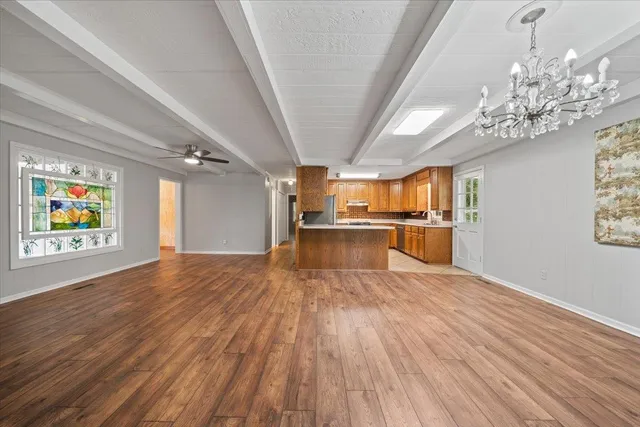 a kitchen with stainless steel appliances granite countertop a sink and cabinets