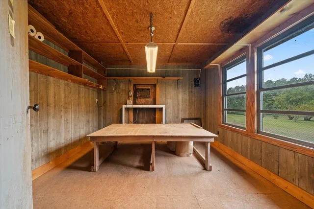 a view of a wooden door and yard