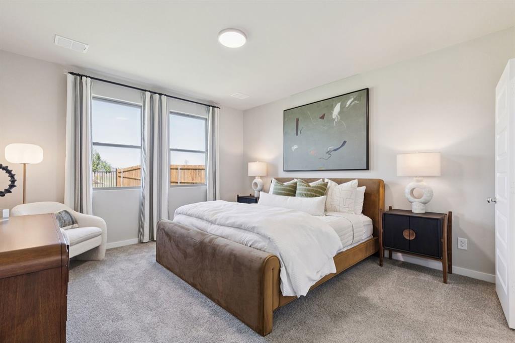 2804 Parkside Trail Princeton, TX 75407 - Photo 14 of 32 a bedroom with a bed and a lamp with window