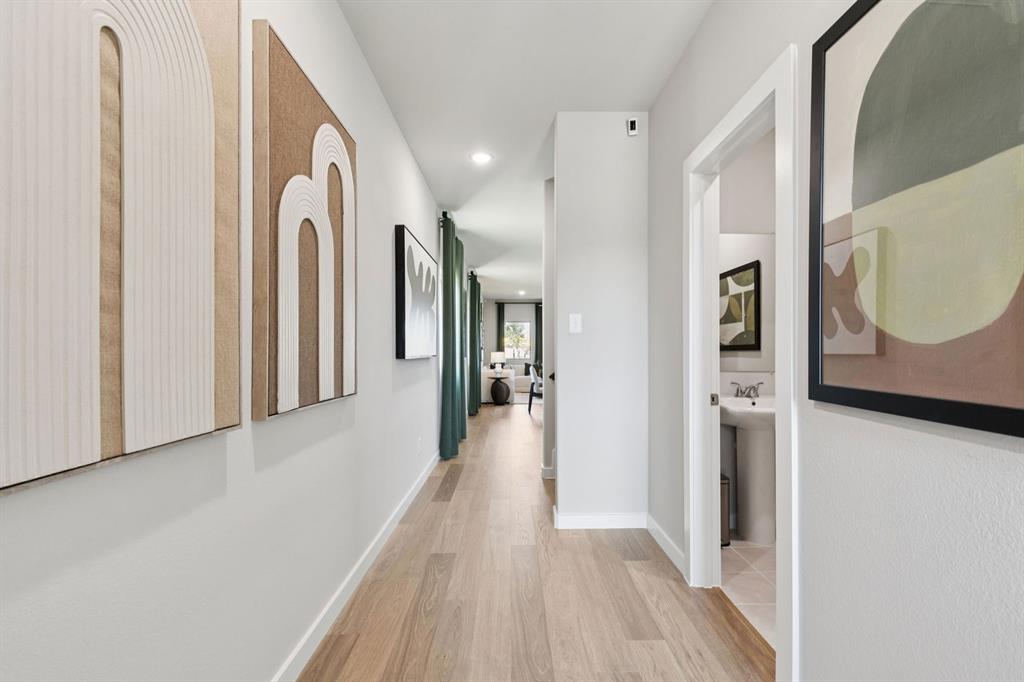 2804 Parkside Trail Princeton, TX 75407 - Photo 29 of 32 a view of a hallway with wooden floor