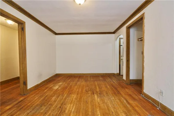 a view of hallway with wooden floor