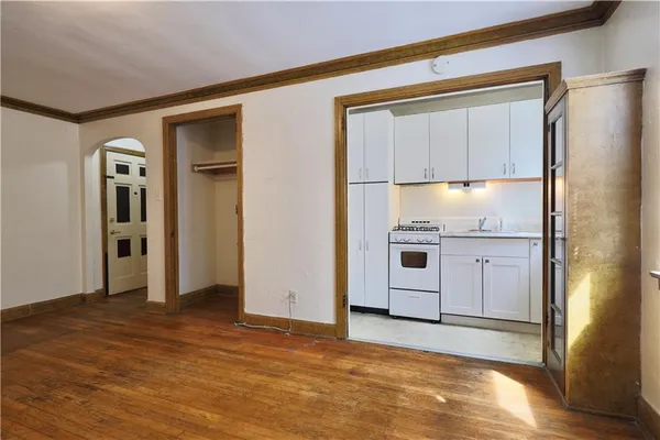 a kitchen with a refrigerator and a stove