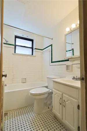 a bathroom with a sink a toilet and a bathtub