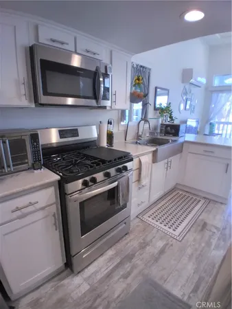 a bathroom with a sink vanity and mirror