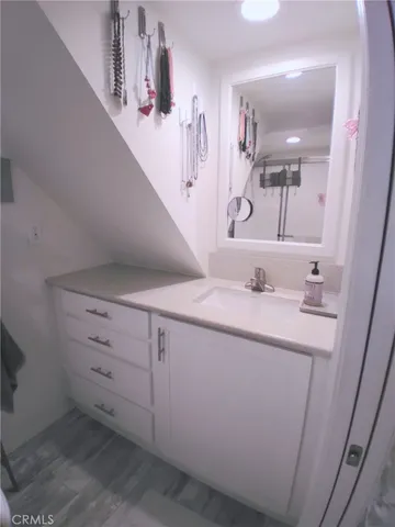 a bathroom with a glass shower door