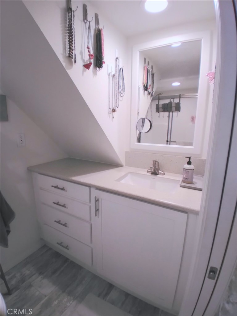 681 Channel Way Needles, CA 92363 - Photo 13 of 26 a bathroom with a sink vanity and mirror