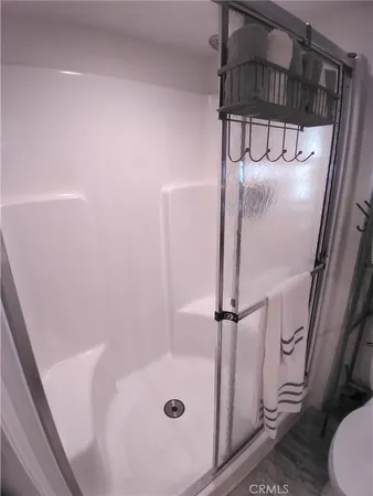 a bedroom with a bed and a lamp