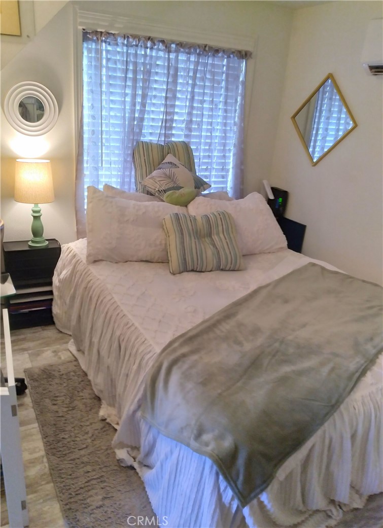 681 Channel Way Needles, CA 92363 - Photo 15 of 26 a bedroom with a bed and a lamp