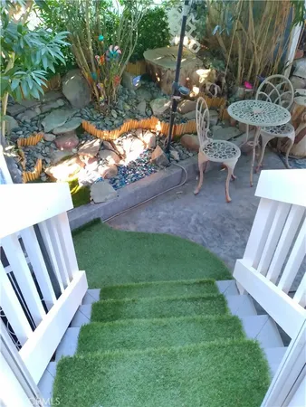 a view of a wooden house with a yard