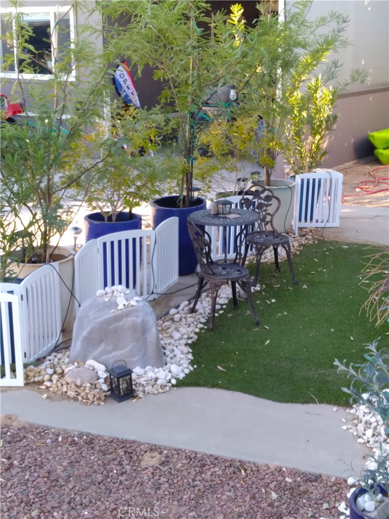 681 Channel Way Needles, CA 92363 - Photo 5 of 26 a view of a chairs and table in backyard