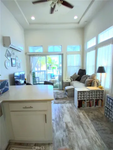 a kitchen with stainless steel appliances wooden cabinets and a stove top oven