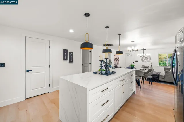 a view of a living room and kitchen
