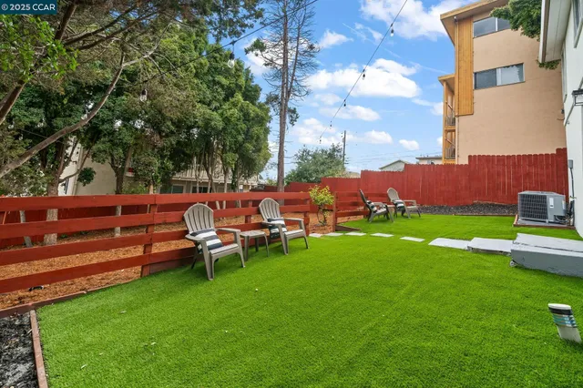 a view of yard with seating area and green space