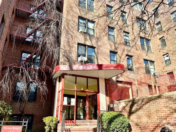a view of a brick building with many windows