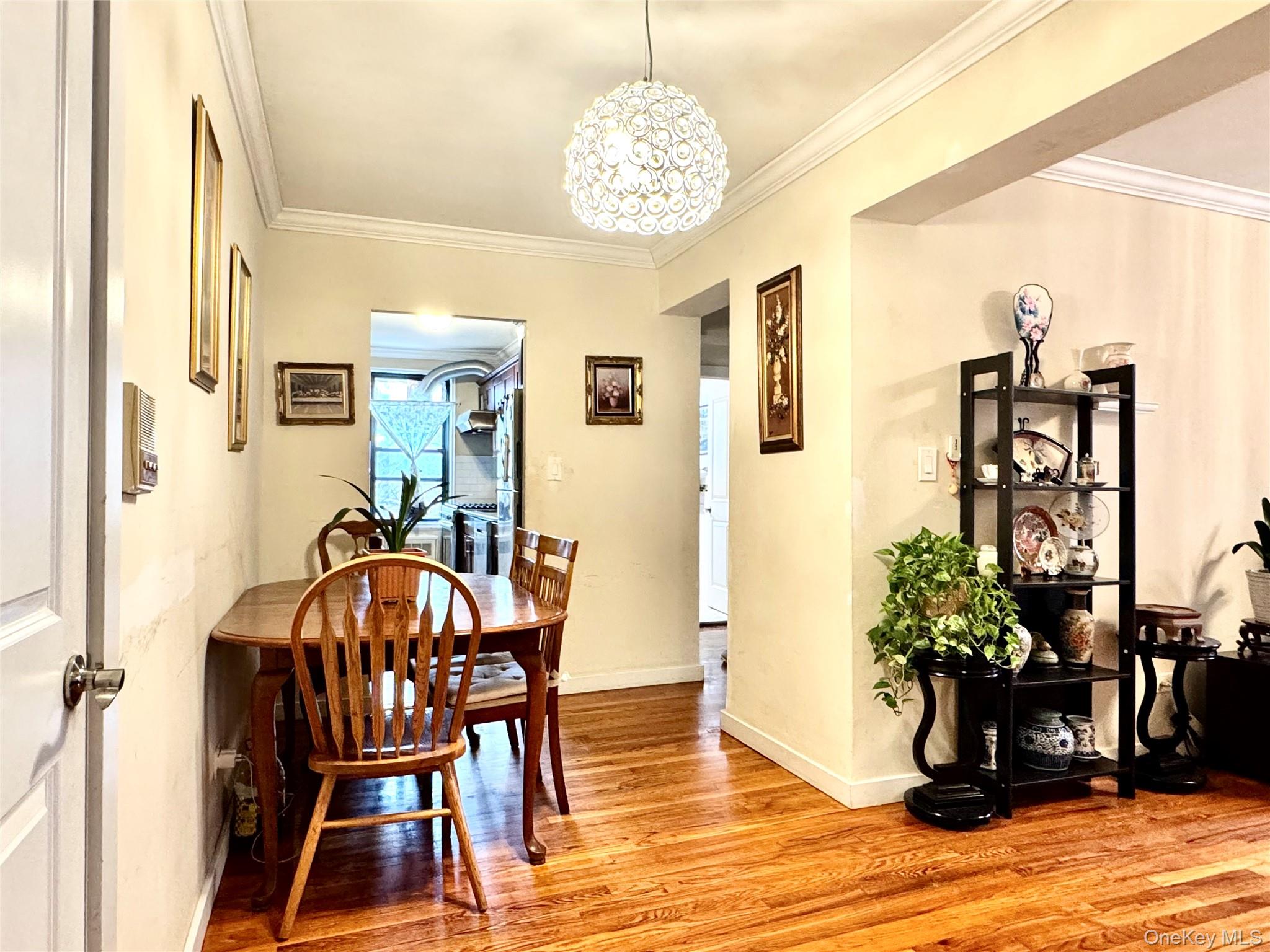 150-25 72nd Road, Unit 4C Queens, NY 11367 - Photo 11 of 16 a view of a dining room with furniture and wooden floor