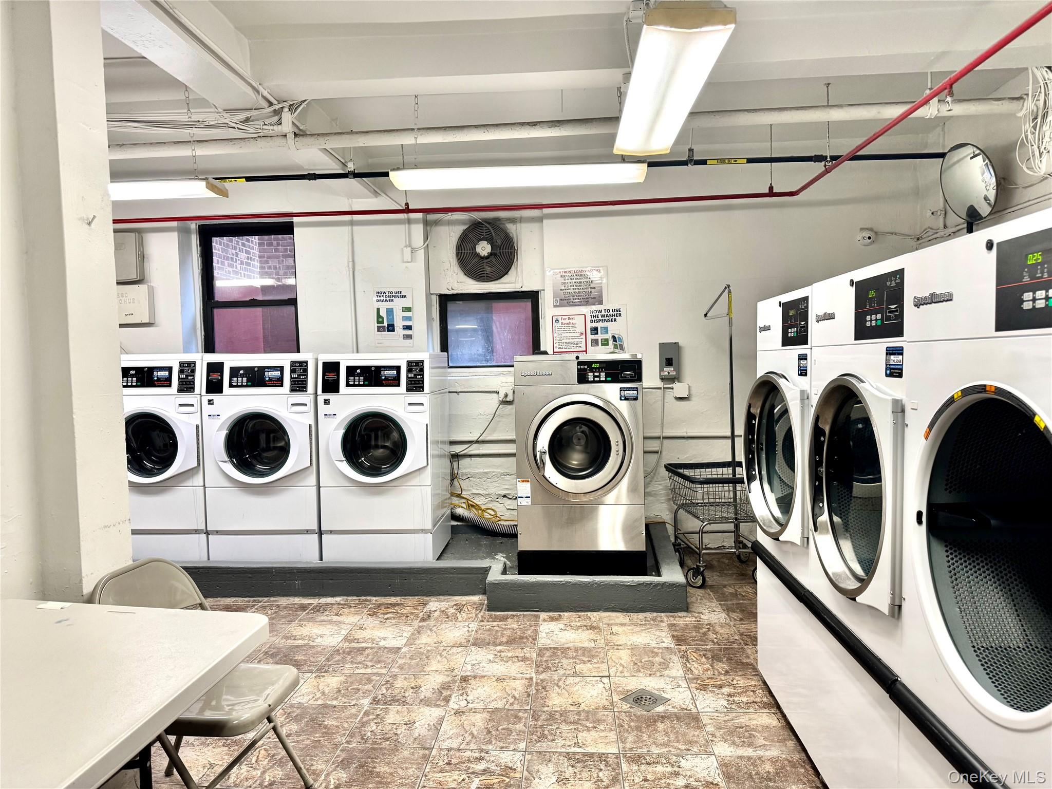 150-25 72nd Road, Unit 4C Queens, NY 11367 - Photo 14 of 16 a utility room with dryer and washer