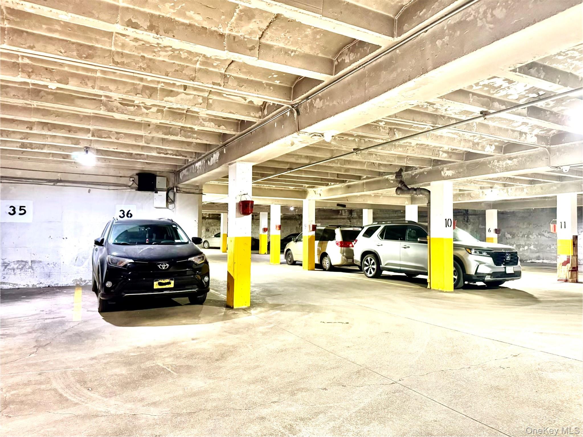 150-25 72nd Road, Unit 4C Queens, NY 11367 - Photo 15 of 16 a car parked in front of garage