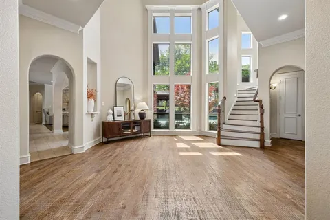 a view of a room with stairs and a wooden floor