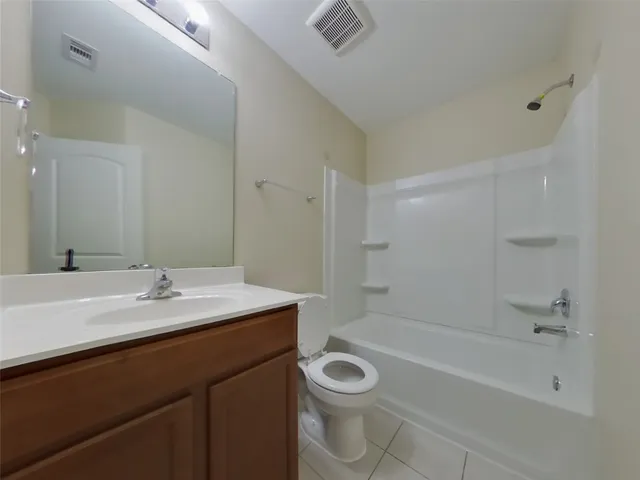 a bathroom with a sink a toilet and a bathtub