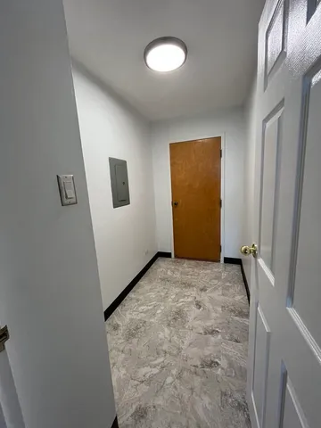 a view of a livingroom with a ceiling fan and window