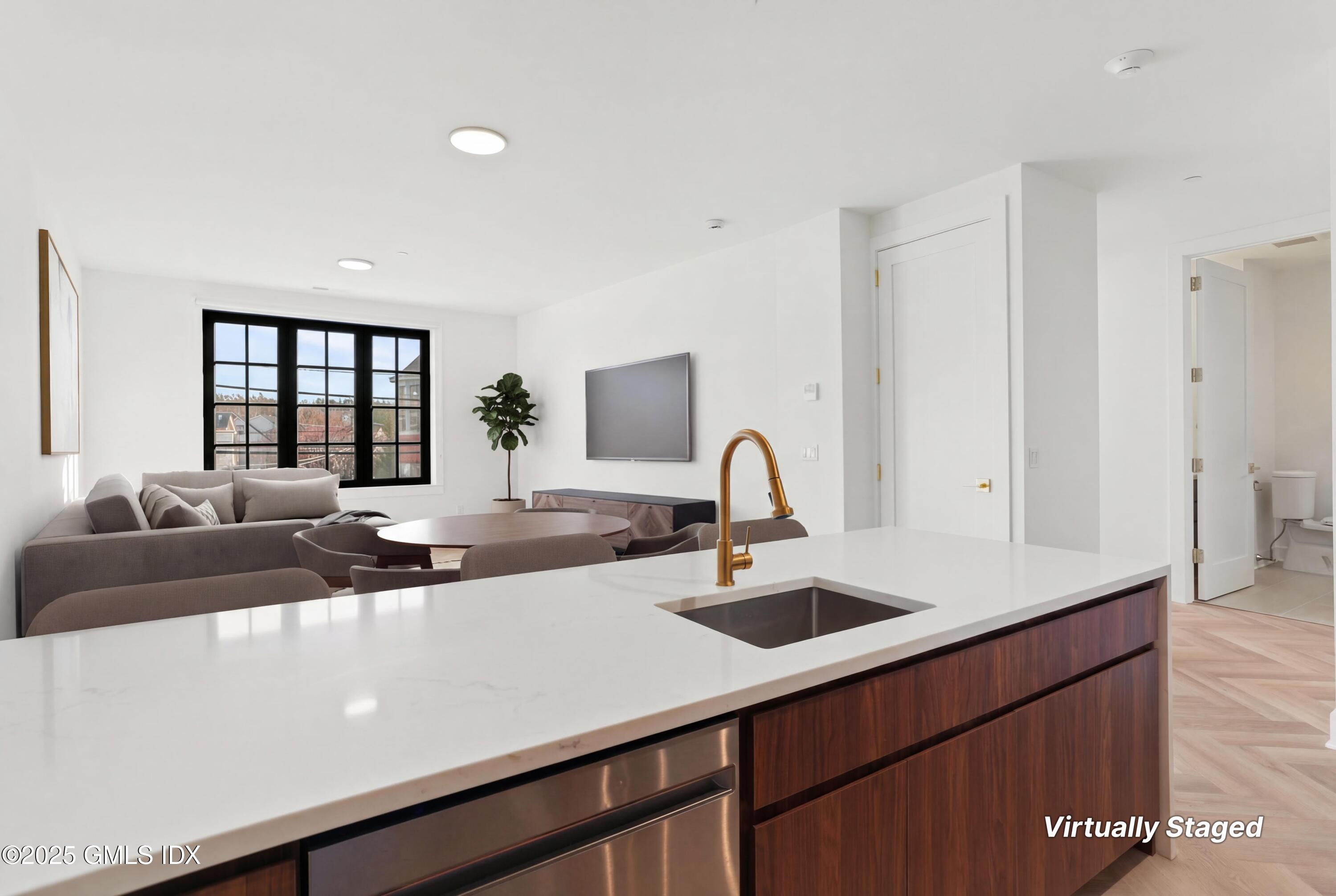 a living room with furniture and window
