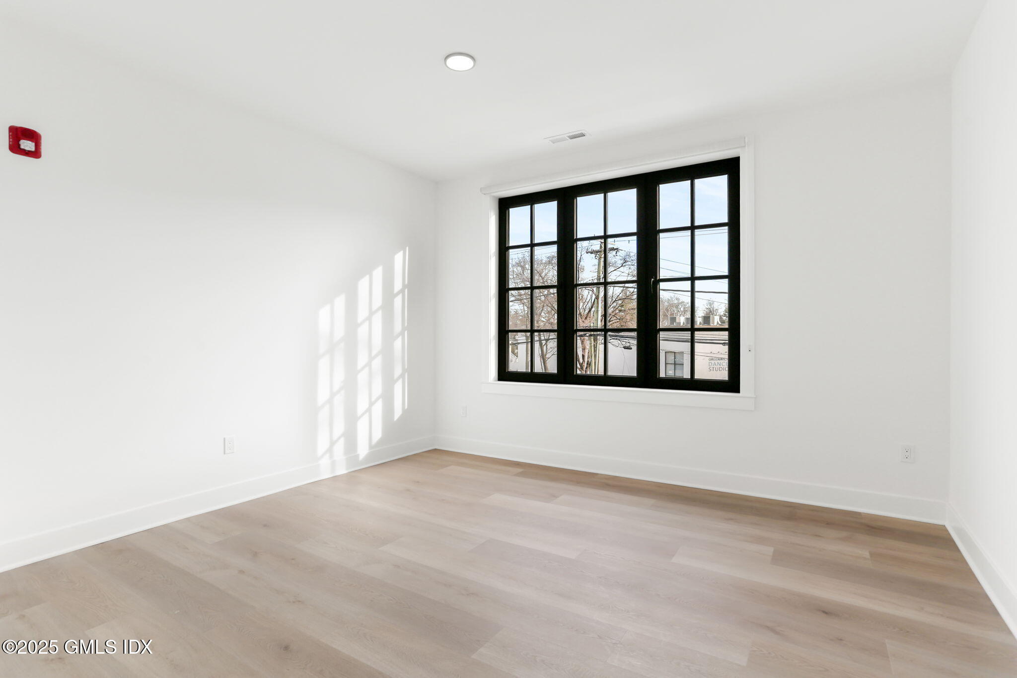 100 East Putnam Avenue, Unit 210 Cos Cob, CT 06807 - Photo 14 of 27 a view of an empty room with a window