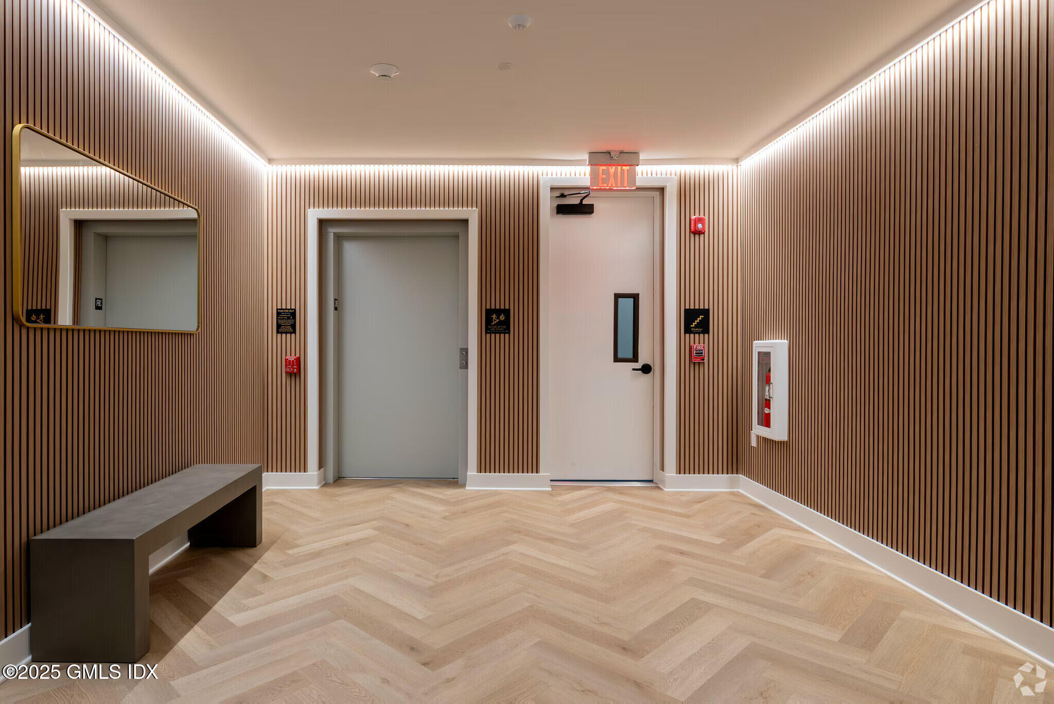 100 East Putnam Avenue, Unit 210 Cos Cob, CT 06807 - Photo 21 of 27 a view of a hallway with wooden floor
