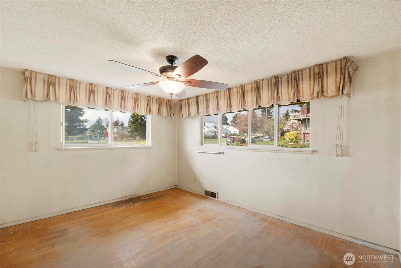 10702 39th Avenue Southwest Seattle, WA 98146 - Photo 15 of 40 a view of an entryway with wooden floor