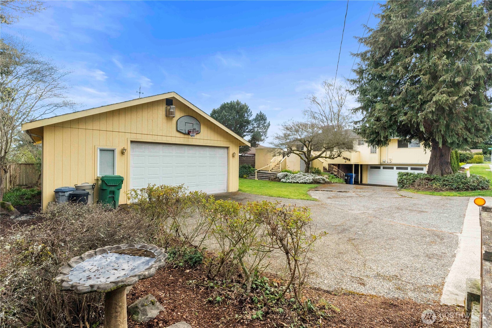 10702 39th Avenue Southwest Seattle, WA 98146 - Photo 34 of 40 a front view of a house with a yard