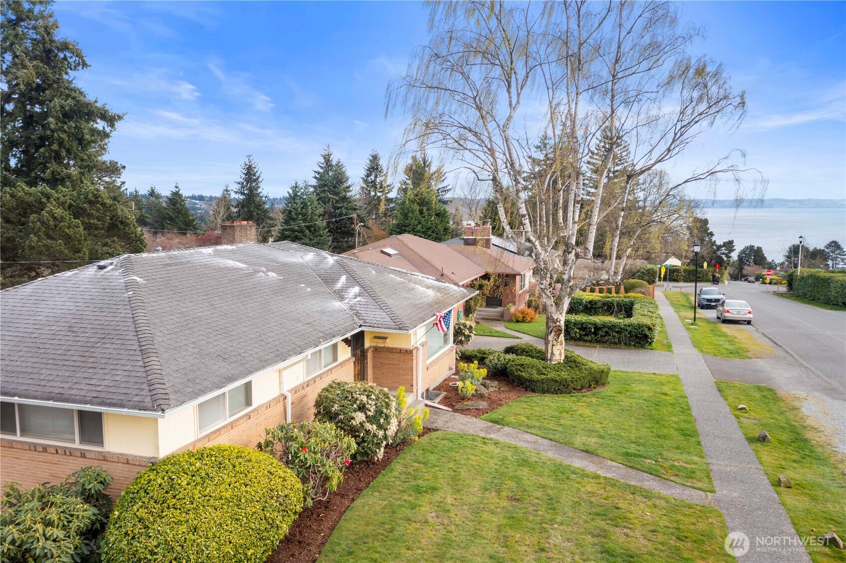 10702 39th Avenue Southwest Seattle, WA 98146 - Photo 36 of 40 a aerial view of a house with swimming pool and trees