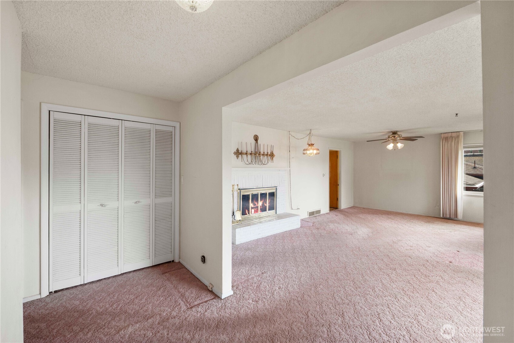 10702 39th Avenue Southwest Seattle, WA 98146 - Photo 4 of 40 a view of a livingroom with wooden floor and closet