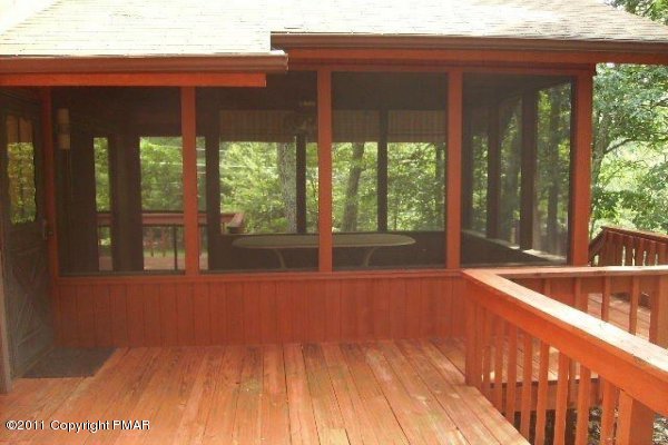 499 Saunders Drive Bushkill, PA 18324 - Photo 8 of 23 view of deck and screen porch