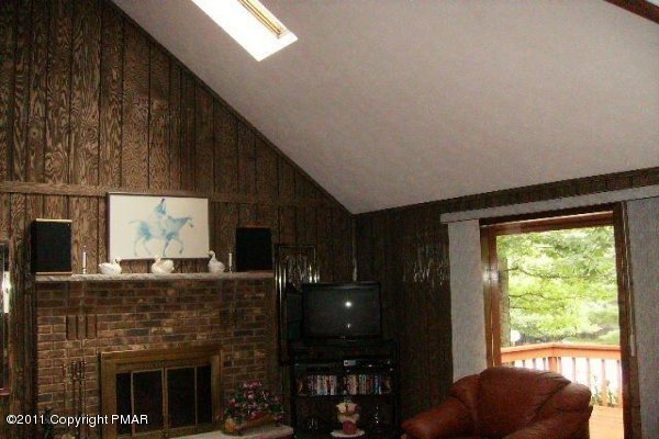 499 Saunders Drive Bushkill, PA 18324 - Photo 10 of 23 livingroom fireplace