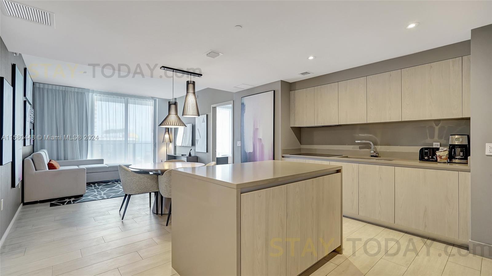 4010 South Ocean Drive, Unit R805 Hollywood, FL 33019 - Photo 13 of 36 a kitchen with counter top space and sink