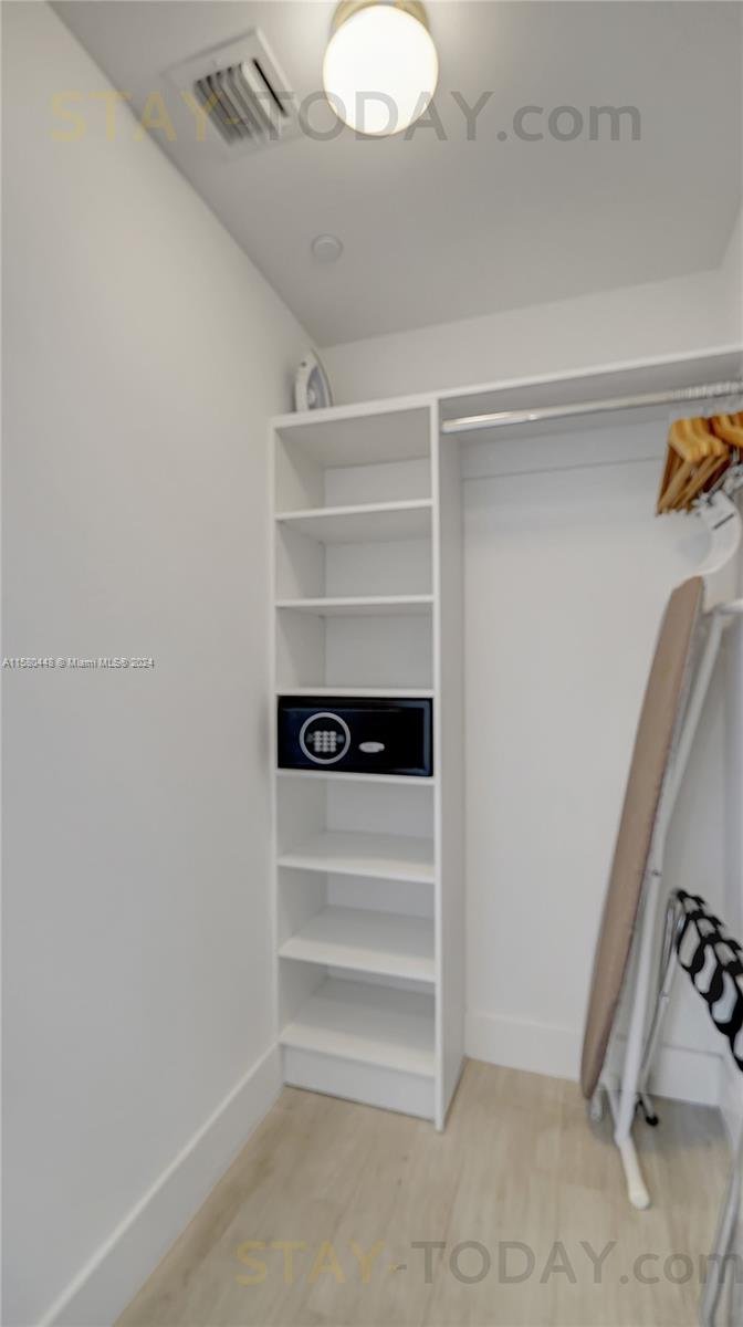 4010 South Ocean Drive, Unit R805 Hollywood, FL 33019 - Photo 19 of 36 a view of walk in closet with empty racks