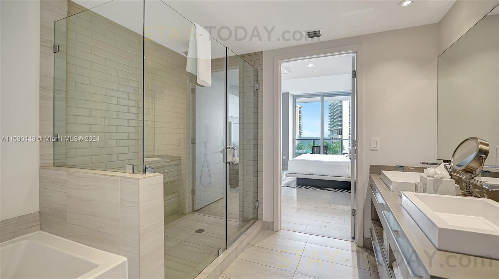 4010 South Ocean Drive, Unit R805 Hollywood, FL 33019 - Photo 23 of 36 a bathroom with a sink a toilet and shower