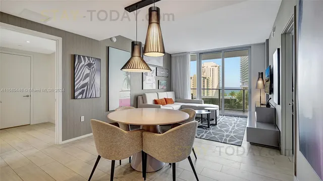 a dining room with furniture and window