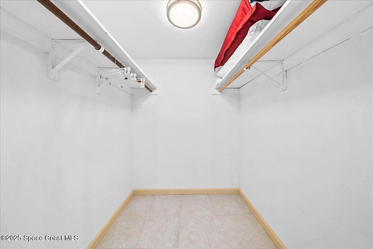 1700 South Atlantic Avenue, Unit 104 Cocoa Beach, FL 32931 - Photo 18 of 55 a view of a room with racks on the wall