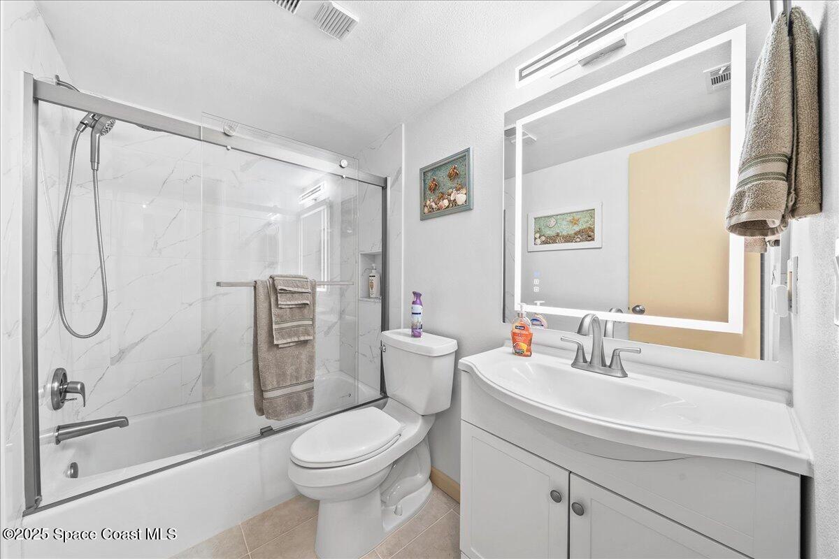 1700 South Atlantic Avenue, Unit 104 Cocoa Beach, FL 32931 - Photo 20 of 55 a bathroom with a sink toilet and shower
