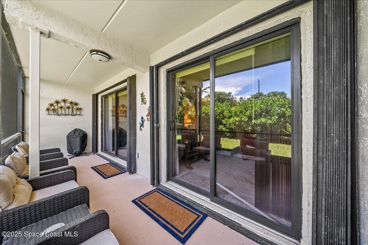 1700 South Atlantic Avenue, Unit 104 Cocoa Beach, FL 32931 - Photo 24 of 55 a living room with furniture